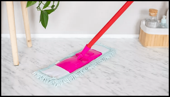 Microfibre spray mop gently cleaning a white marble floor