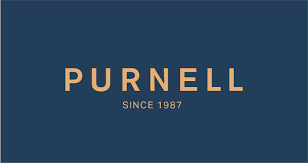 A blue and gold logo for purnell since 1987