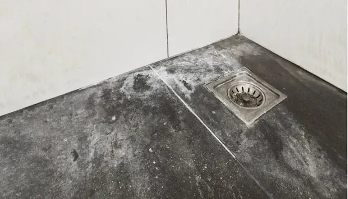 Soap scum buildup on shower floor