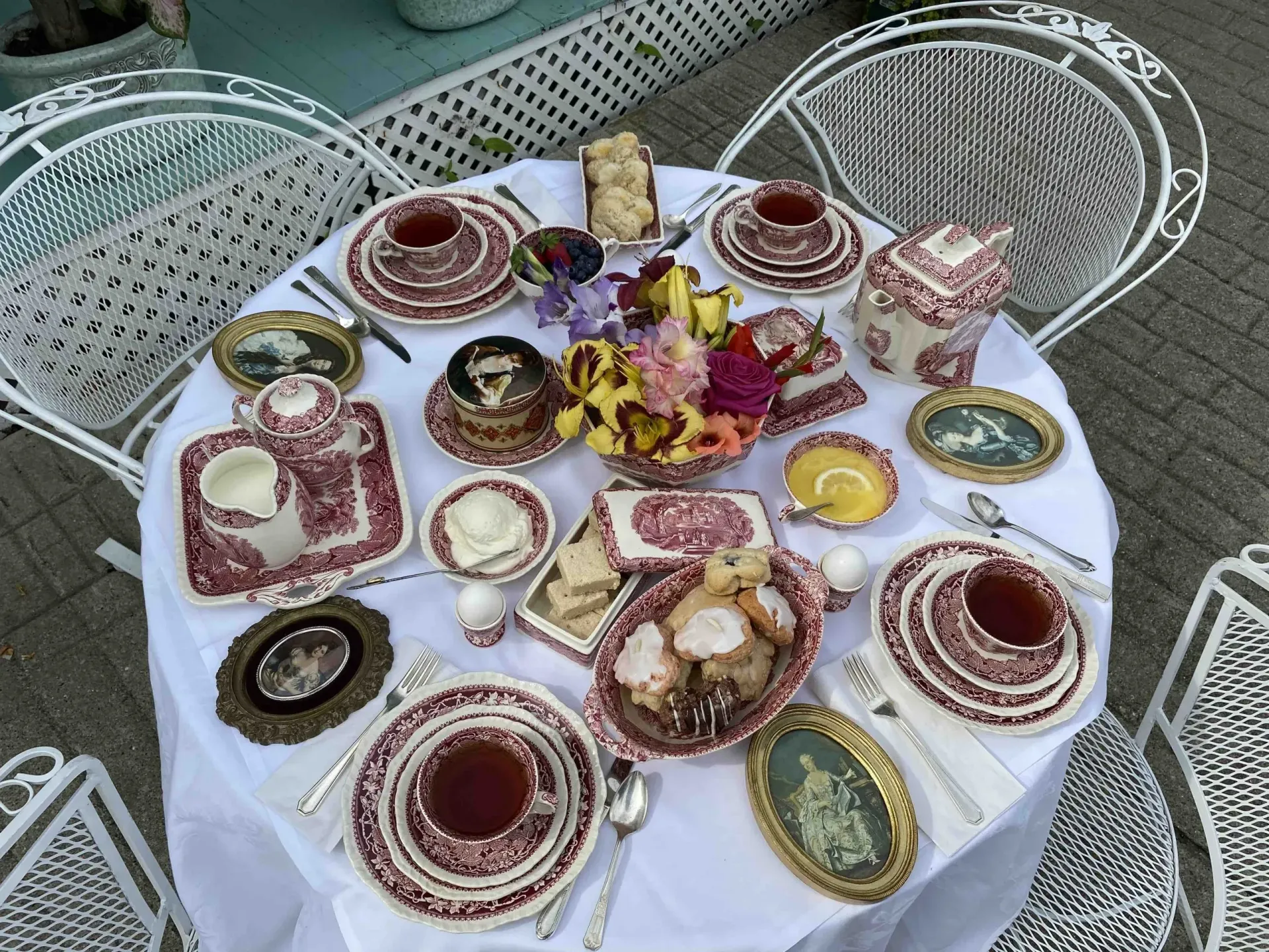 A table with a lot of plates and cups on it.