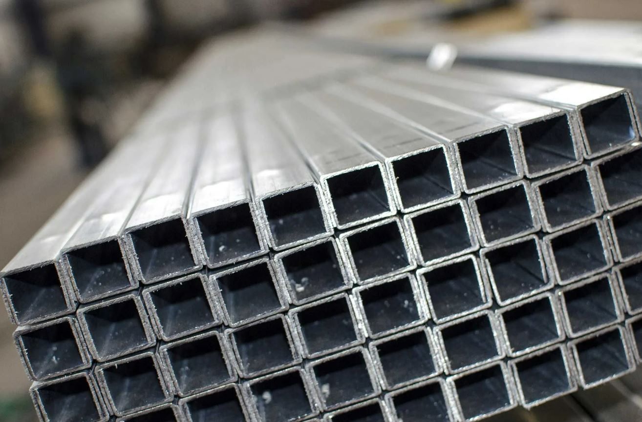 A Bunch of Square Metal Pipes Stacked on Top of Each Other — Febos Welding and Engineering In Dapto, NSW