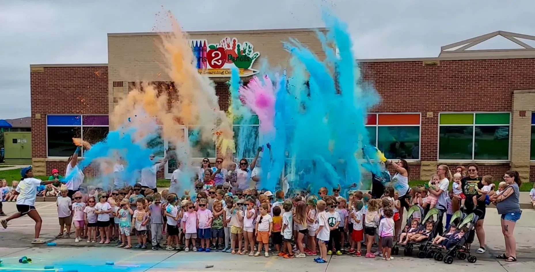 Crayons2Pencils celebrating outside with Non-Toxic Holi Powder,