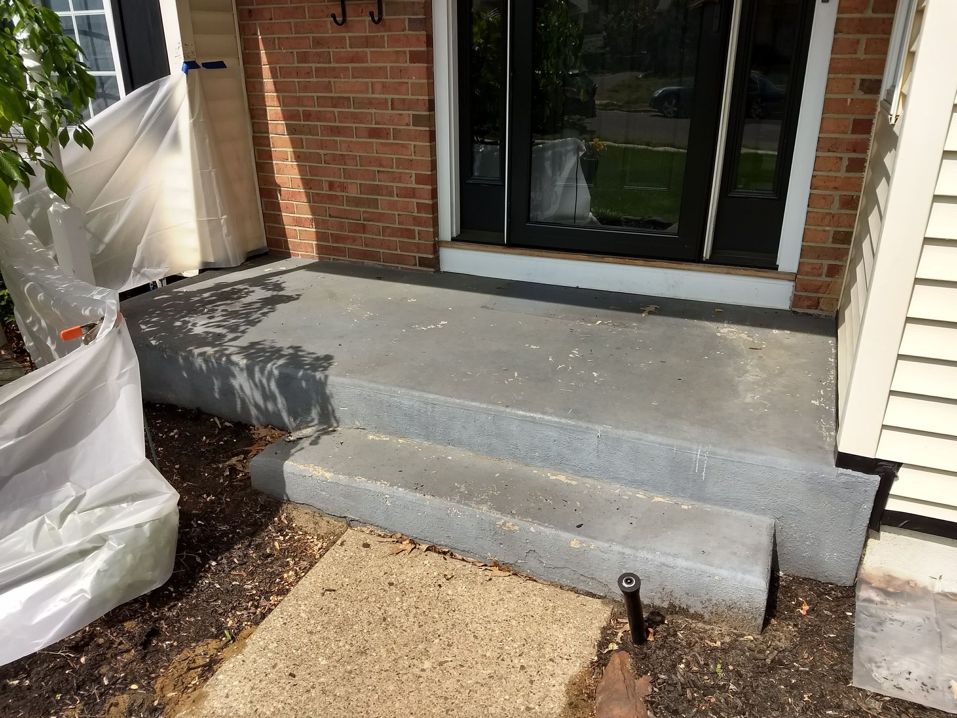 Before Patio paint removal in Levittown Pa