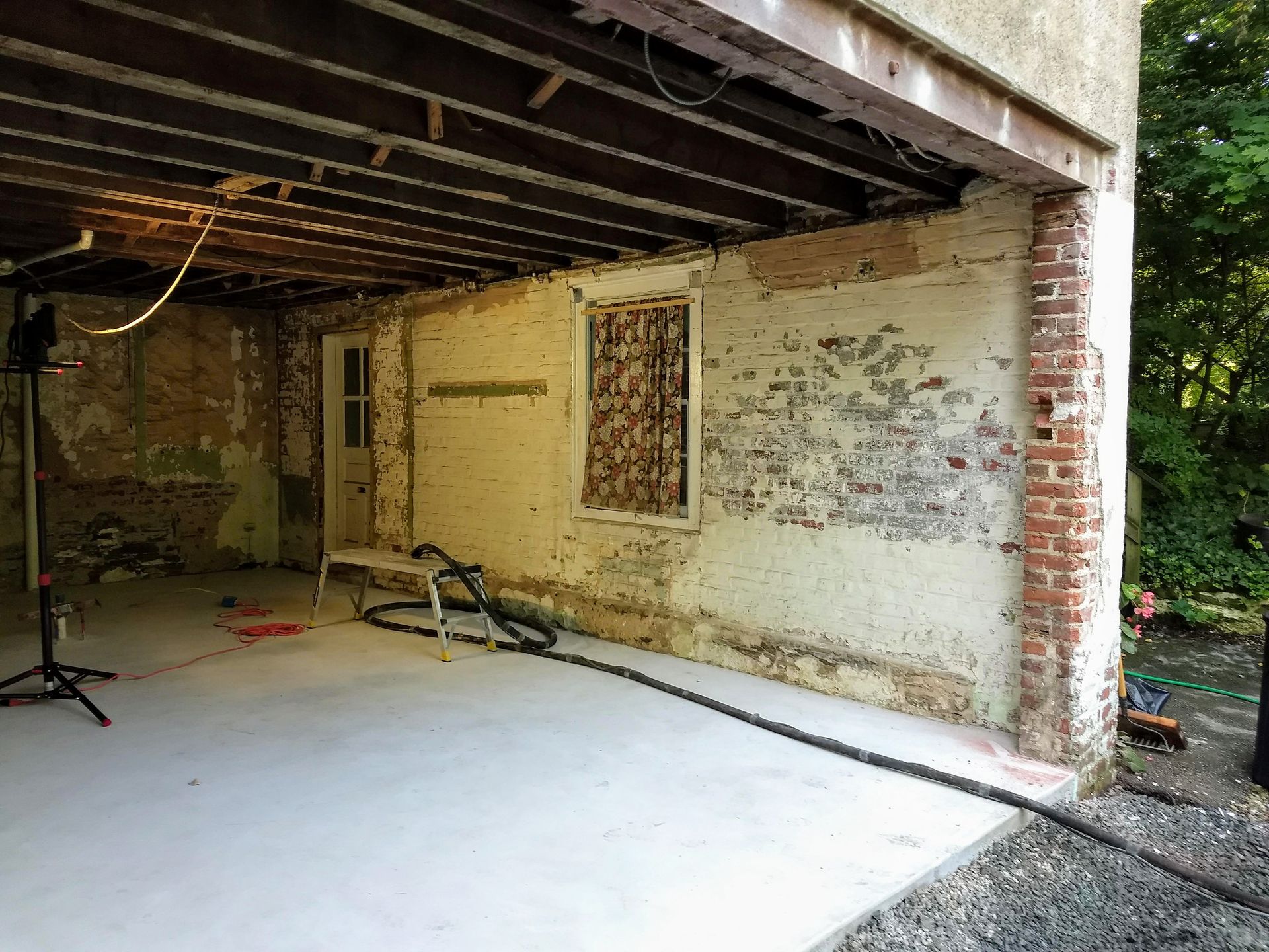 Before blasting paint from brick in Philadelphia