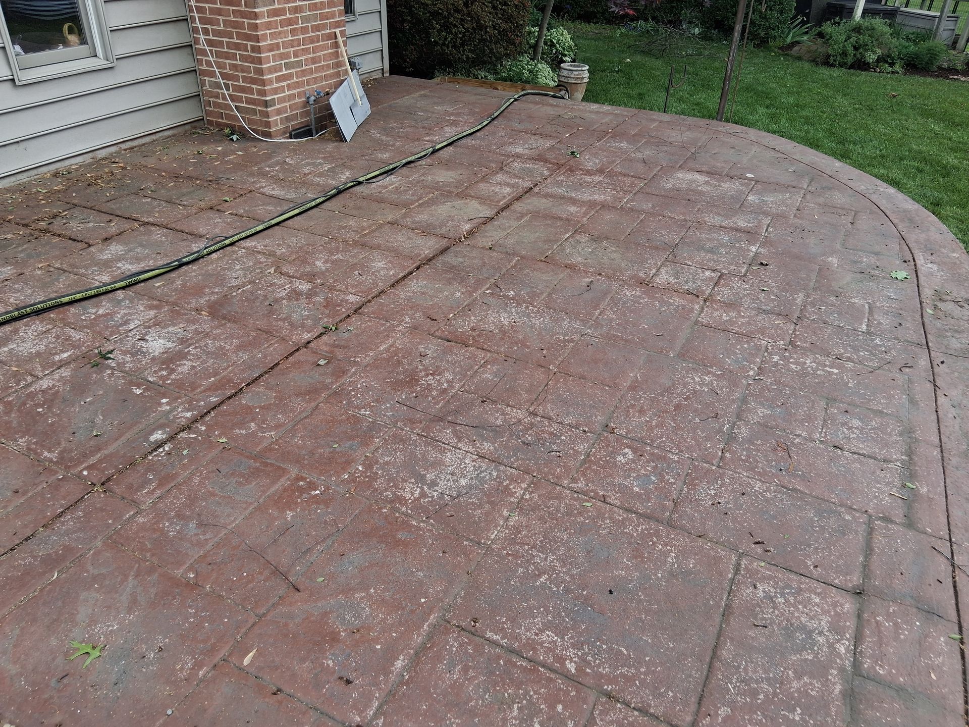 Before concrete patio stain and sealer sandblasting removal in Richboro Pa