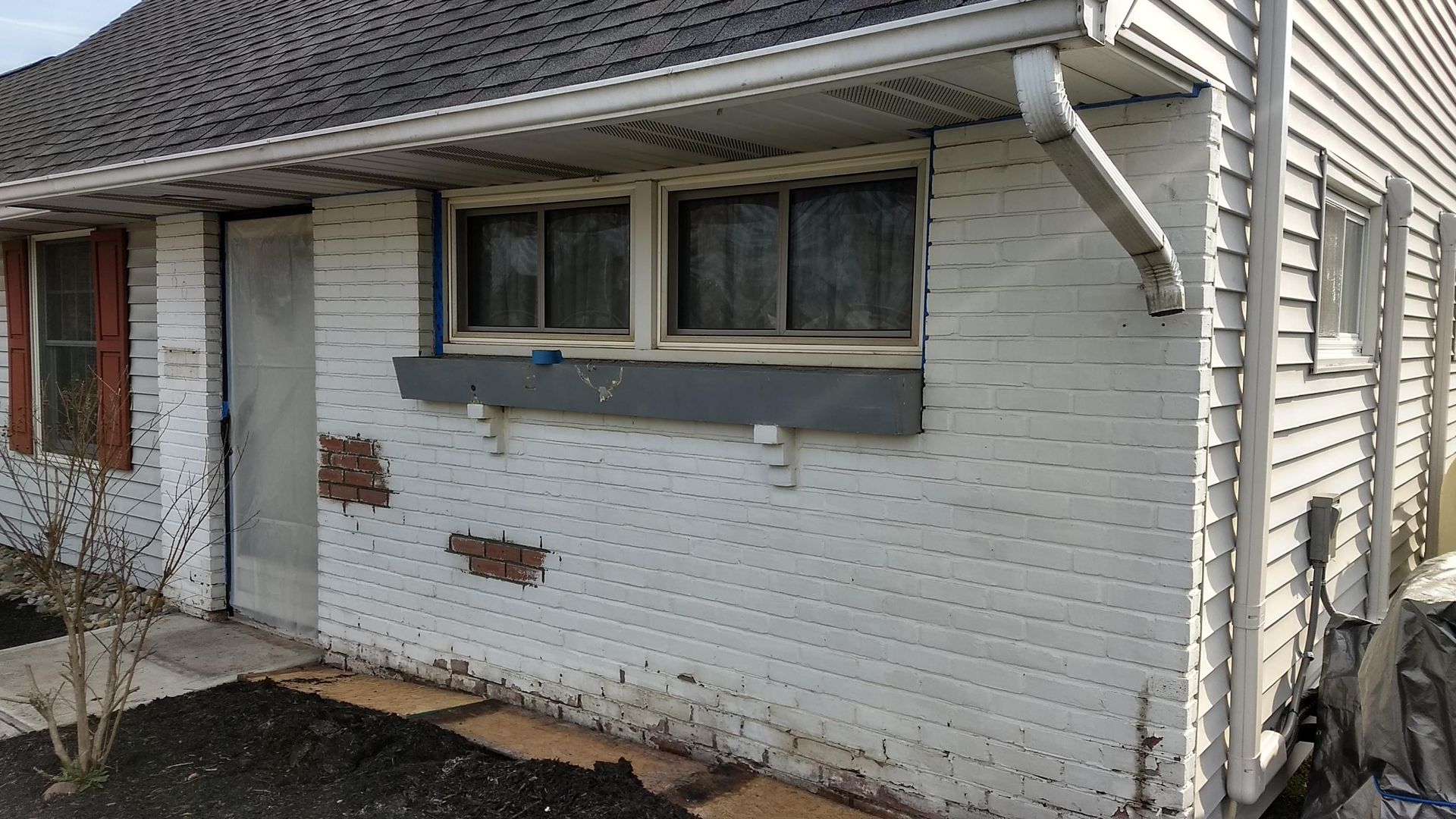 Before paint removal from brick in Levittown Pa