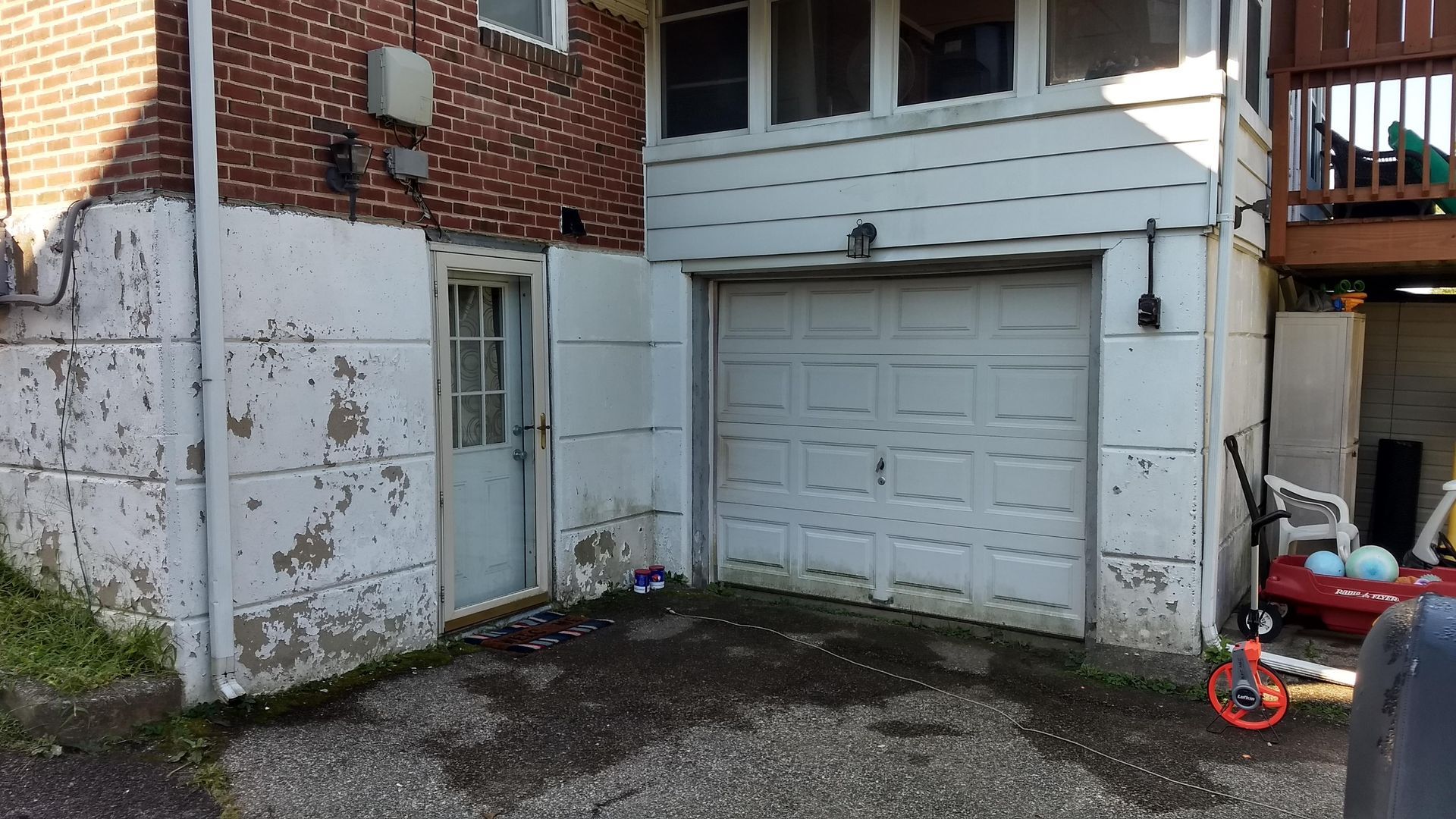 Before paint removal from concrete foundation in King of Prussia Pa