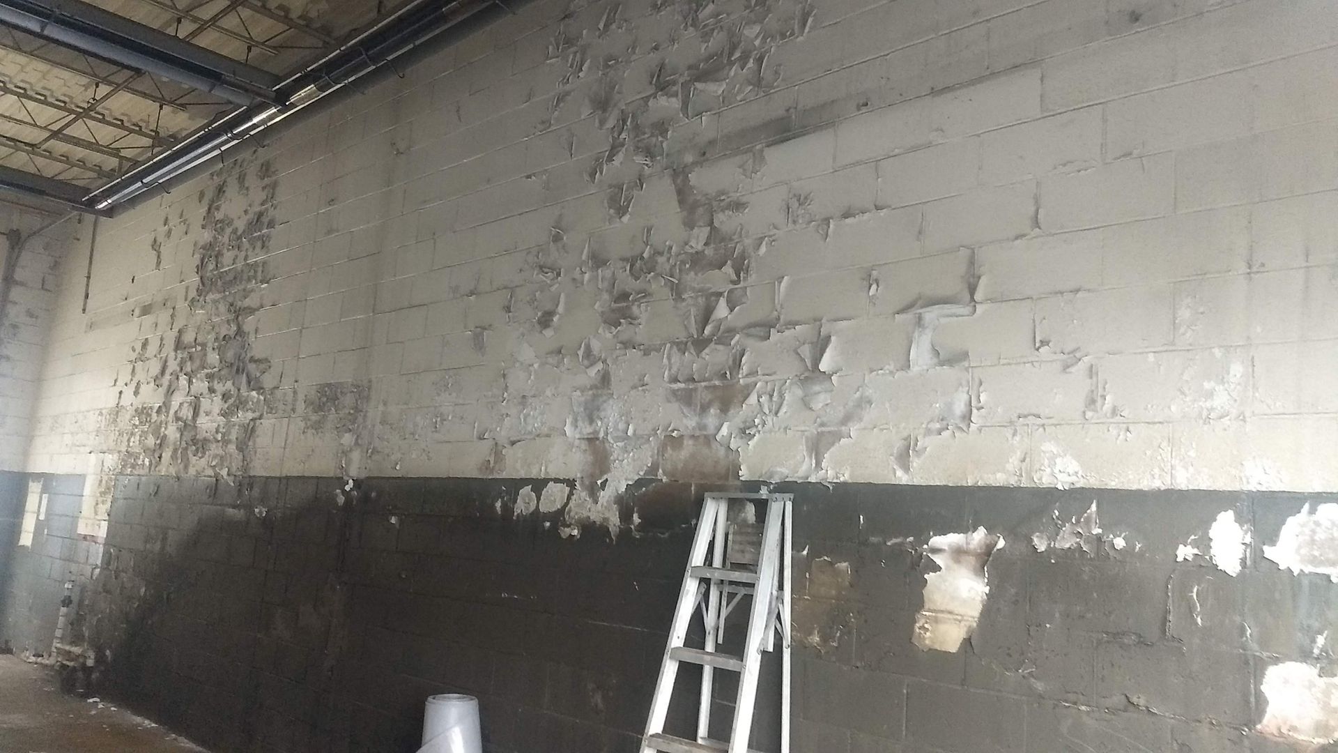 Before paint stripping from cinder block in Philadelphia Pa