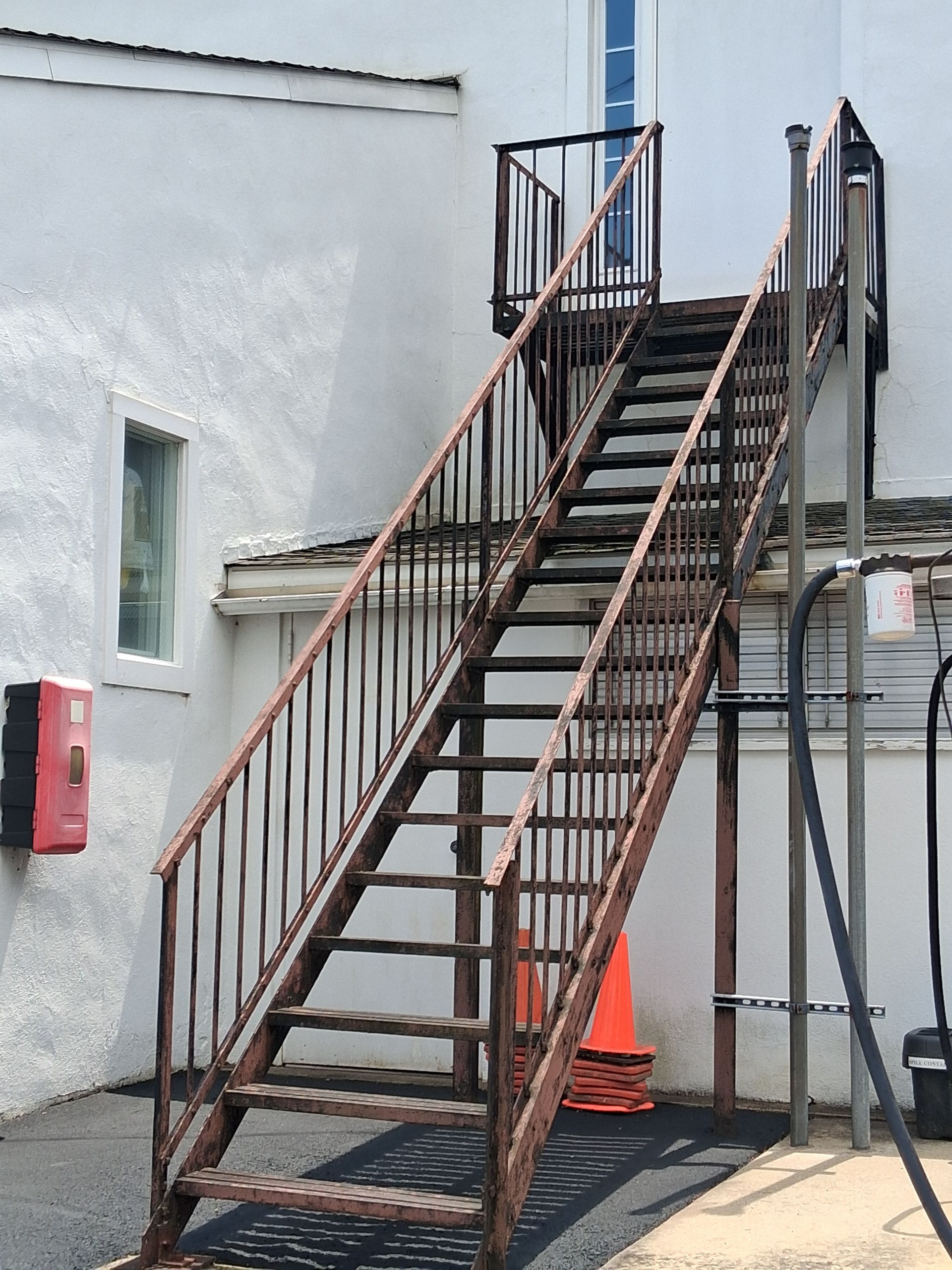 Before sandblasting fire escape stairs in New Hope Pa
