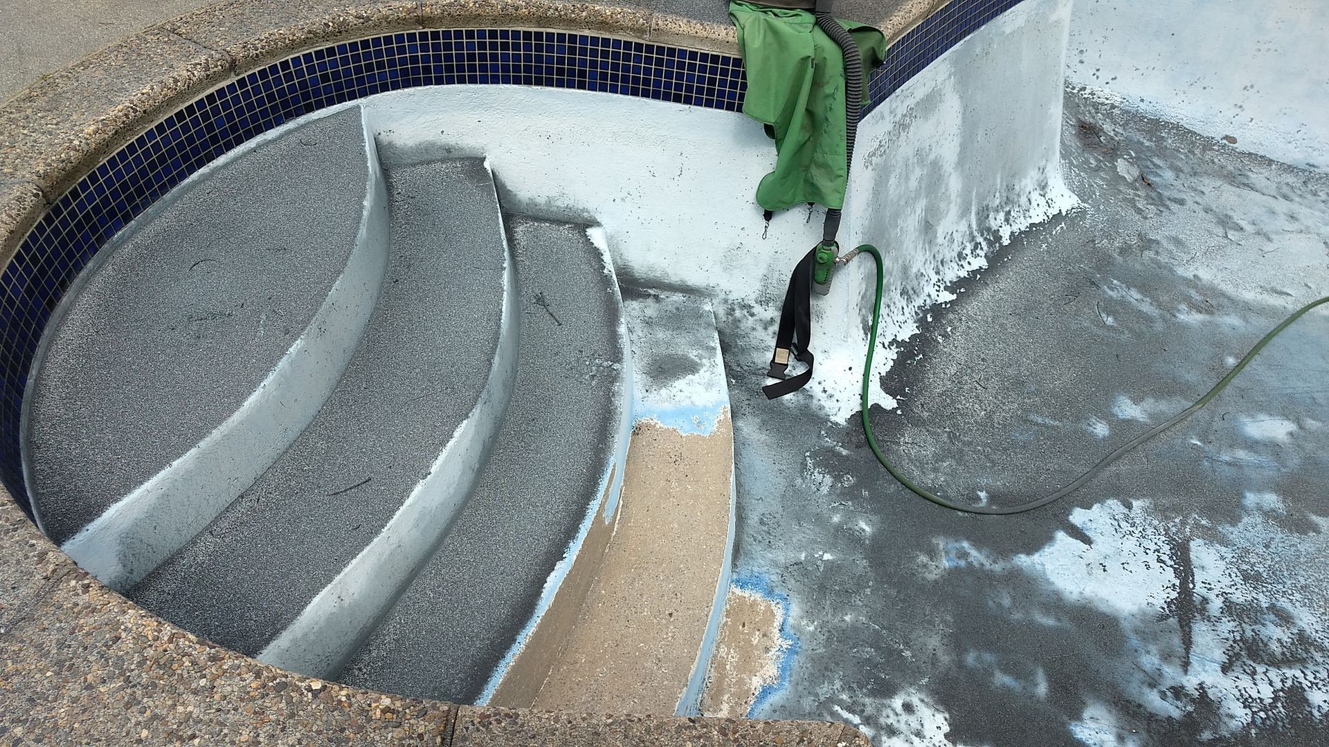 Before swimming pool paint removal in Mount Laurel NJ.