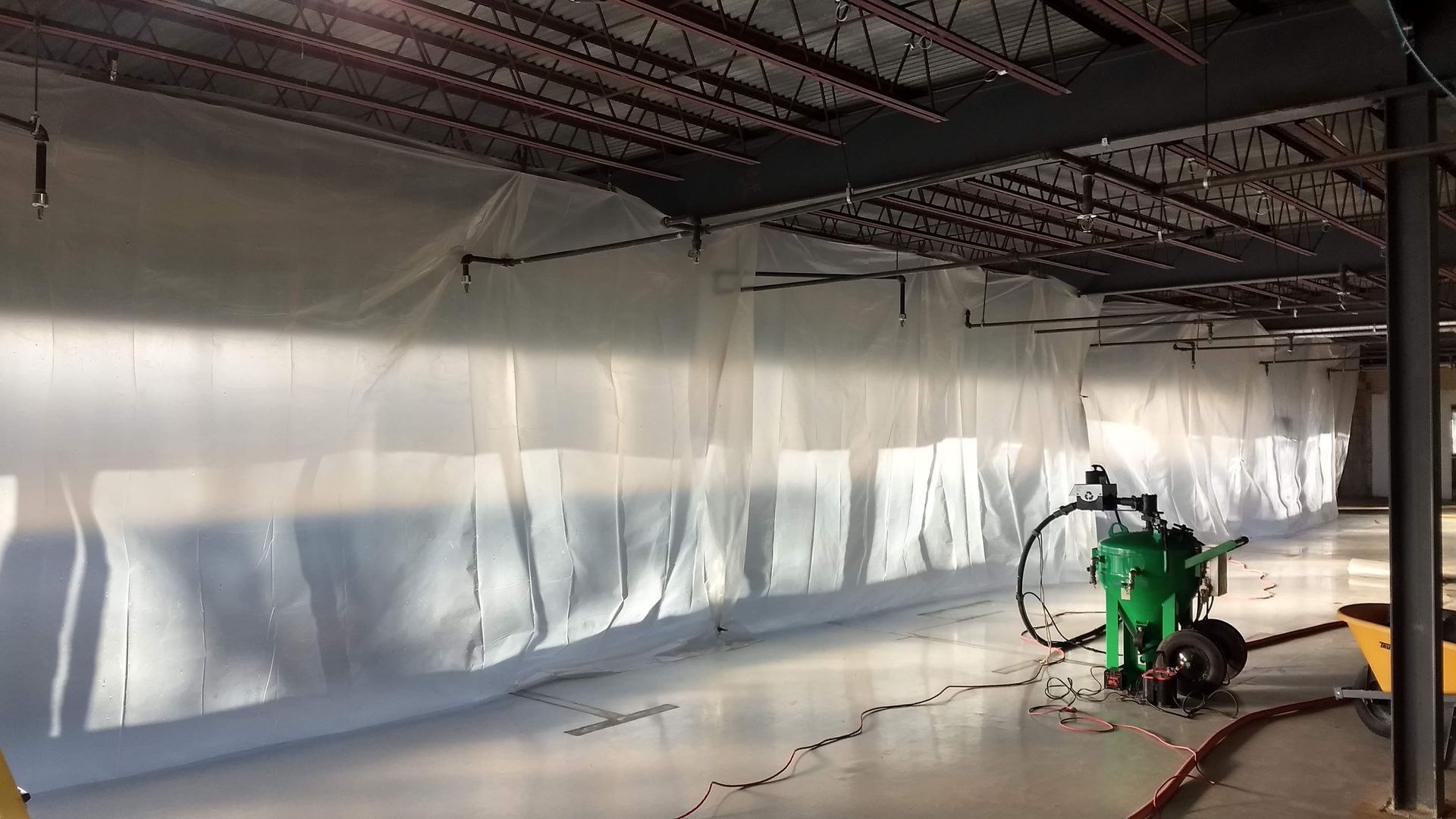 Sandblasting steel in an Industrial building in Philadelphia Pa