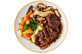 Plate of steak slices with mushrooms and colorful vegetables on a white dish