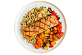 Grilled salmon with rice and roasted vegetables on a white plate