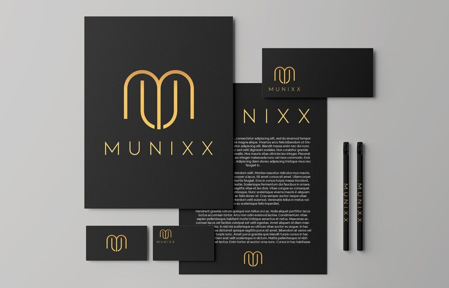 Black-and-gold MUNIXX brand stationery mockup with logo, letterhead, cards, and pens
