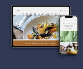 Tablet and phone mockup for Terracotta vegan restaurant website, with food and green-themed pages