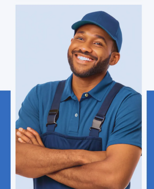 Smiling delivery worker in blue uniform and cap with arms crossed against a light background