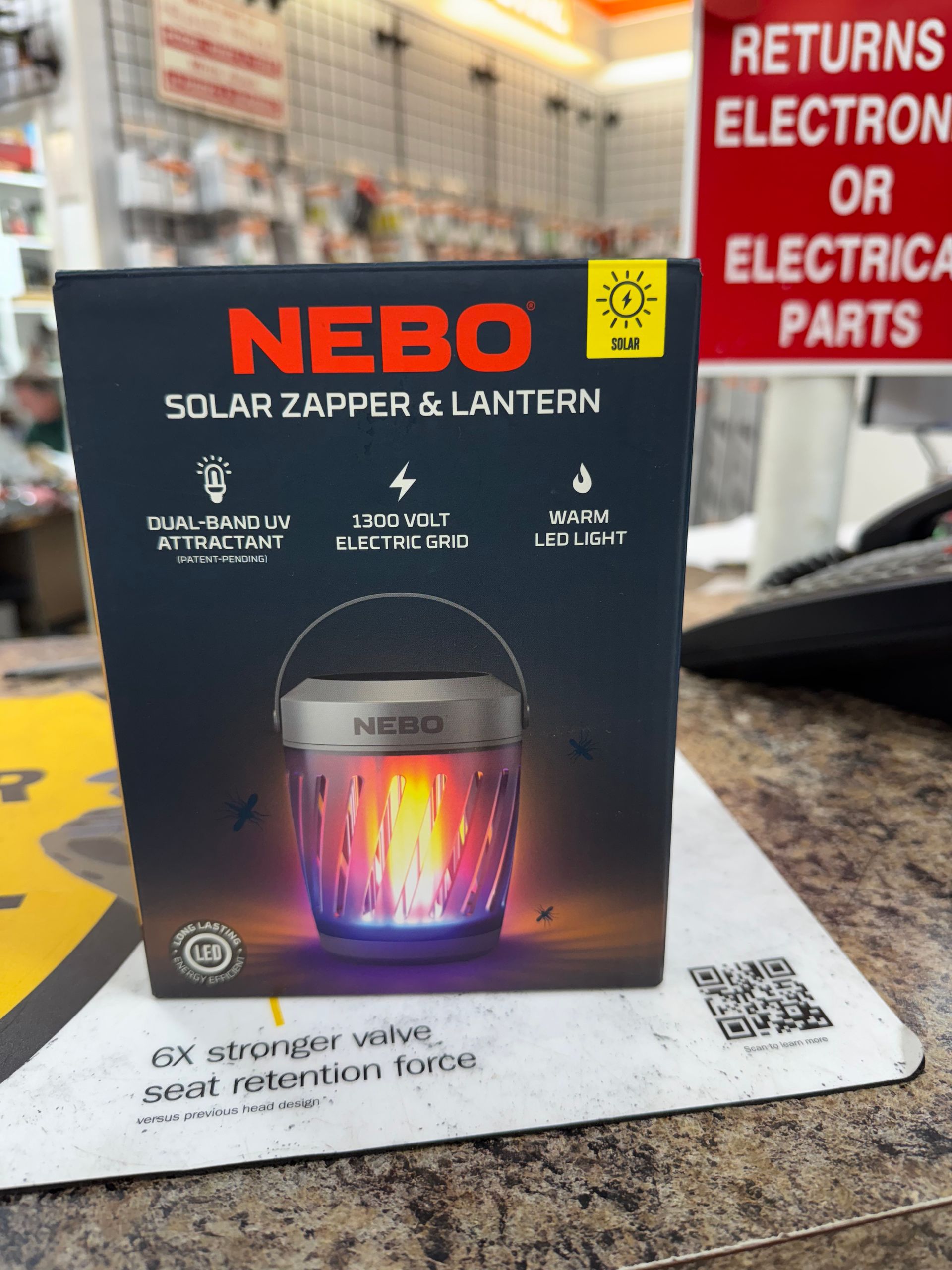 Nebo Solar Zapper & Lantern box with graphic of a glowing bug zapper. Text includes 