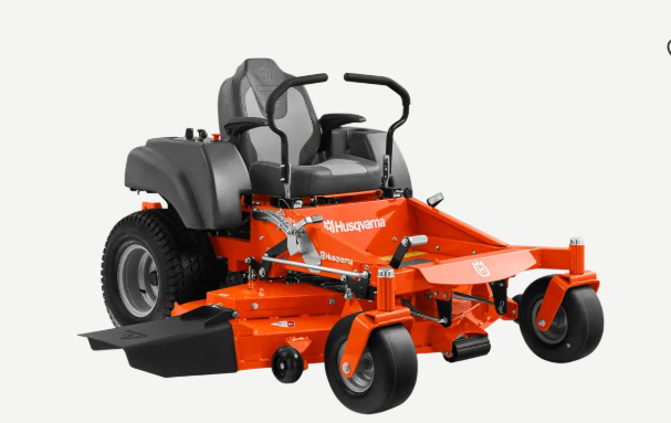 Orange Husqvarna zero-turn riding lawn mower with black seat and deck, on a neutral background.