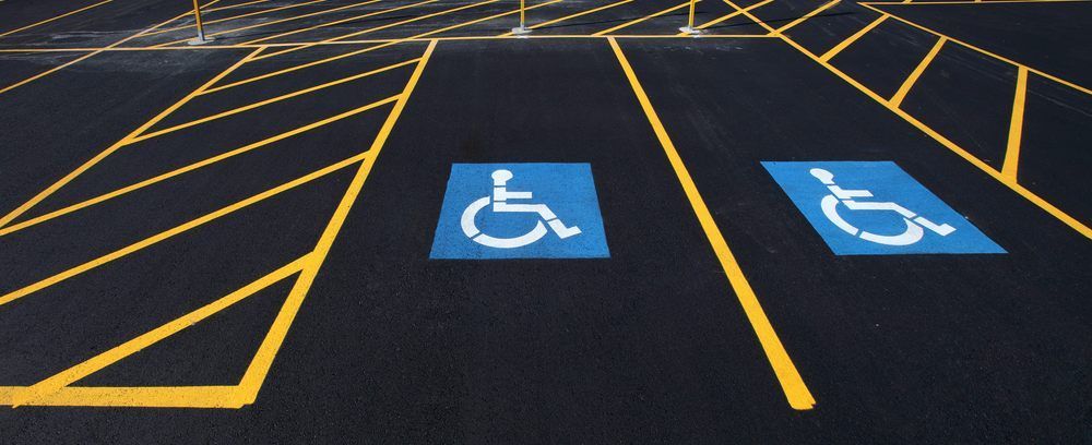A parking lot with handicap signs painted on it