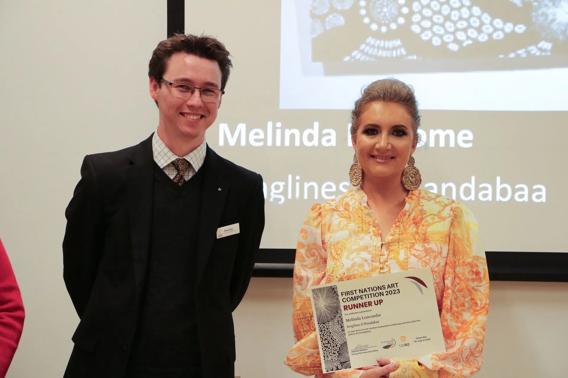 UniSQ Gallery Curator Brodie Taylor and Senior 2D Medium Runner Up Melinda Luscombe