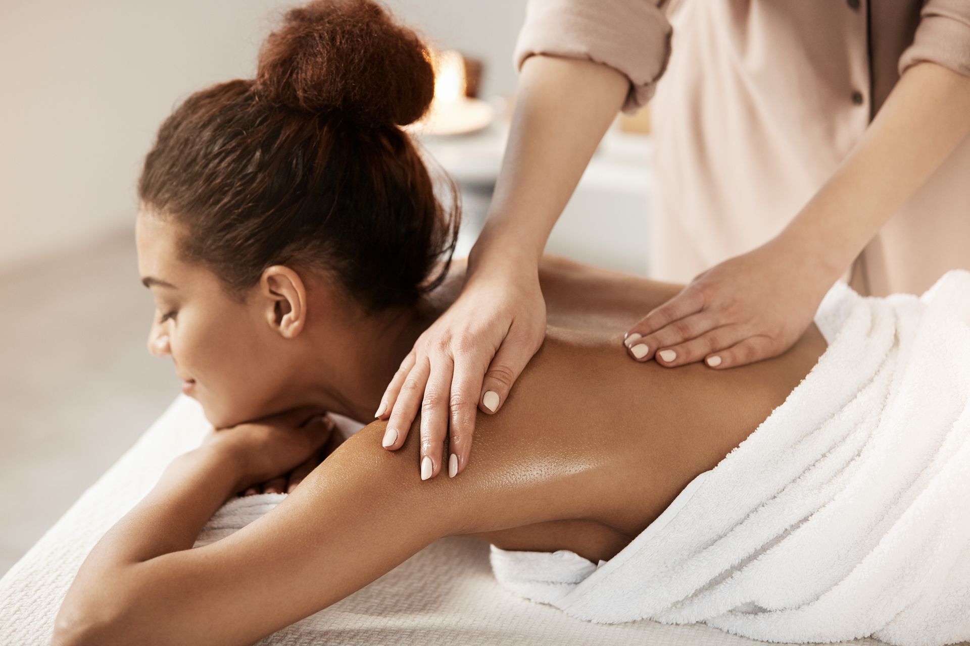 A woman is getting a massage in a spa.