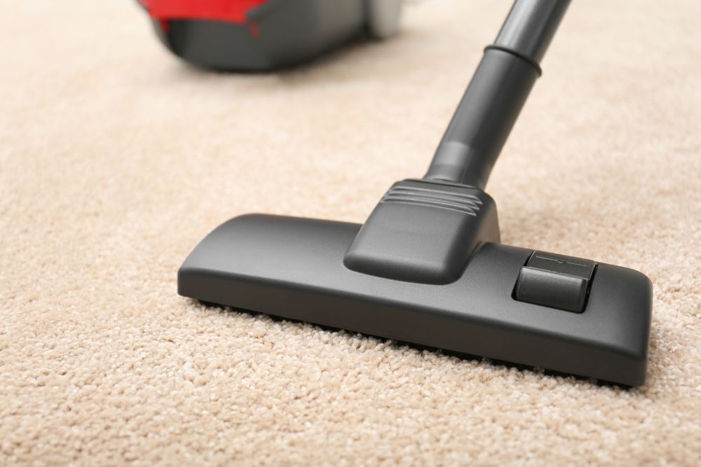 Vacuum Cleaner Nozzle Cleaning Beige Carpet — Level Electrical & Air In Taminda, NSW