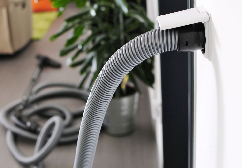 Central Vacuum Hose Connected to a Wall Outlet — Level Electrical & Air In Taminda, NSW