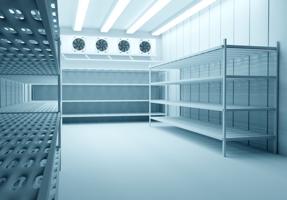 Empty Walk-in Freezer With Metal Shelving and Ventilation Fans — Level Electrical & Air In Taminda, NSW