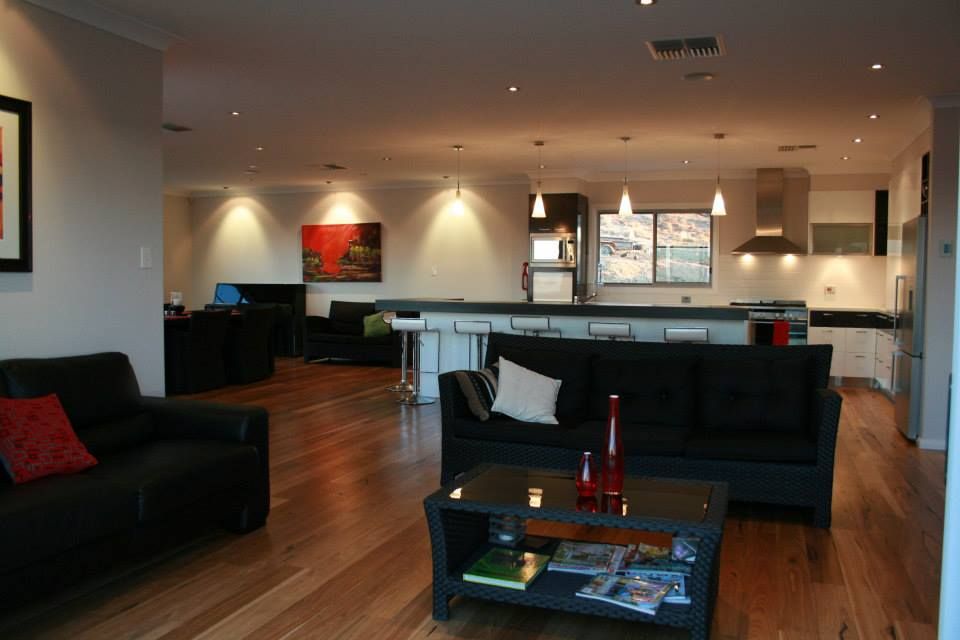 Spacious Open-plan Living Area With Hardwood Floors — Level Electrical & Air In Taminda, NSW