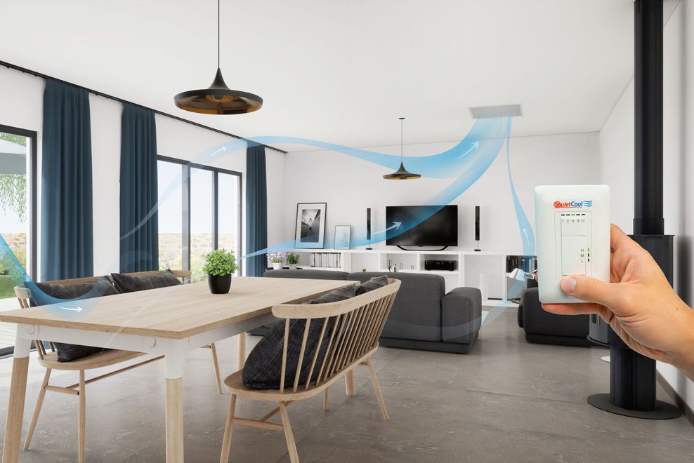 Modern living room with dining table, TV, and hand holding a smartphone with a home control app