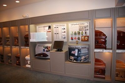 Elegant display of urns and memorial products in a funeral home showroom