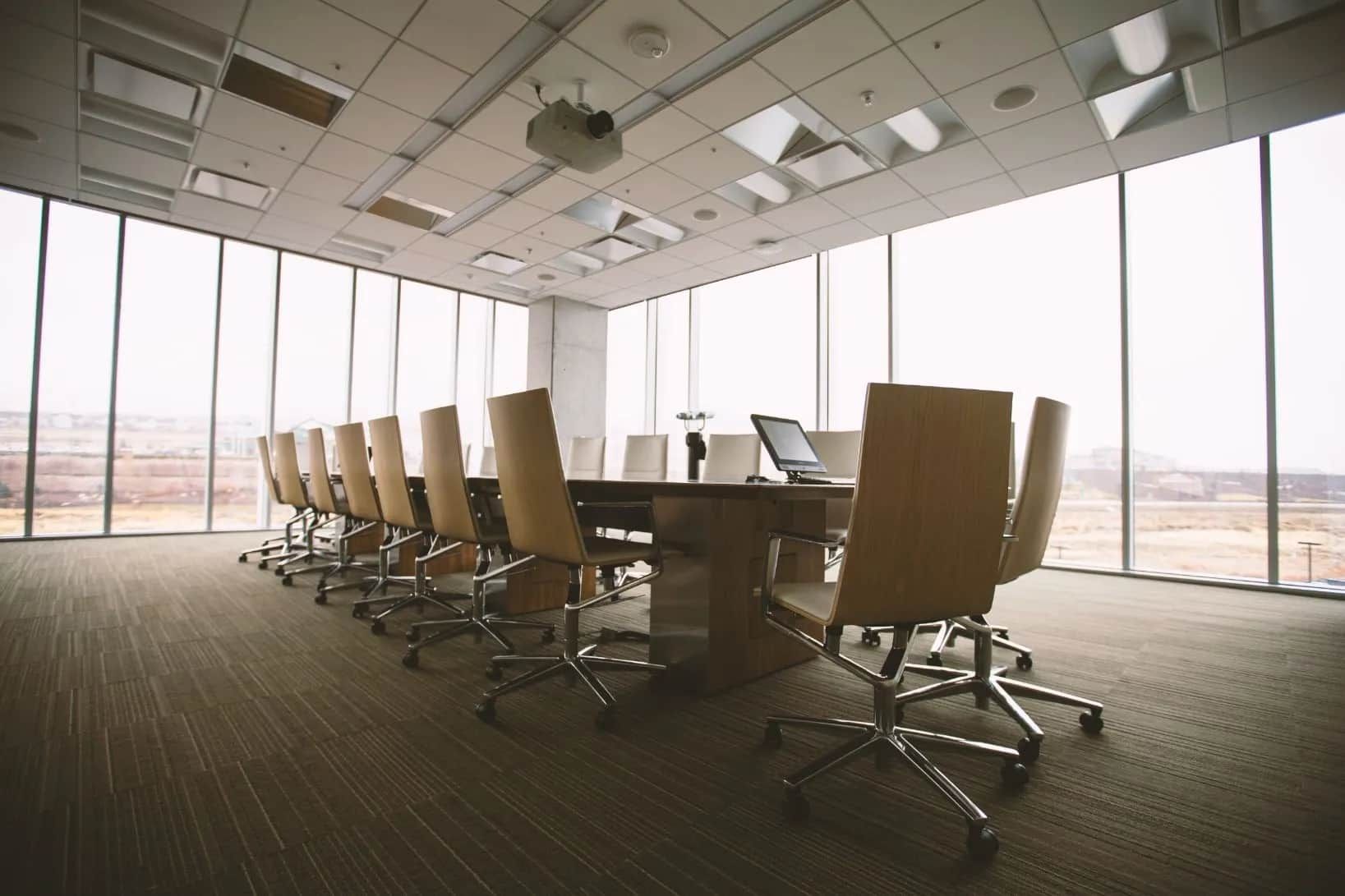 A Conference Room With a Long Table and Chairs and a Lot of Windows — Jendata In Garbutt, QLD