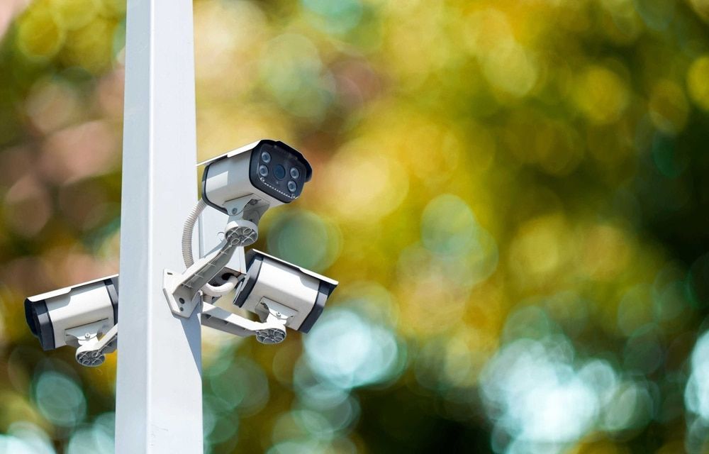 Three Security Cameras Mounted on a White Pole — Jendata In Ingham, QLD