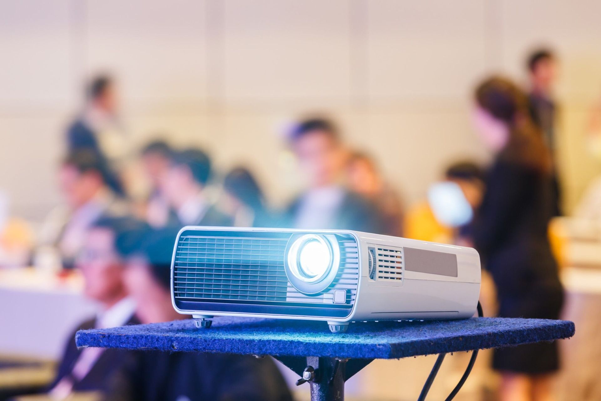 Projector Displaying Light in a Room Full of People — Jendata In Kirwan, QLD