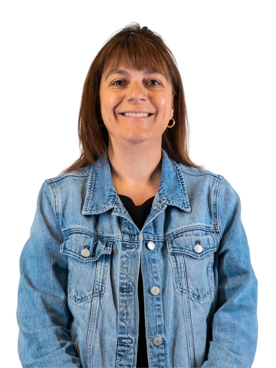 Smiling person in a light blue denim jacket against a white background