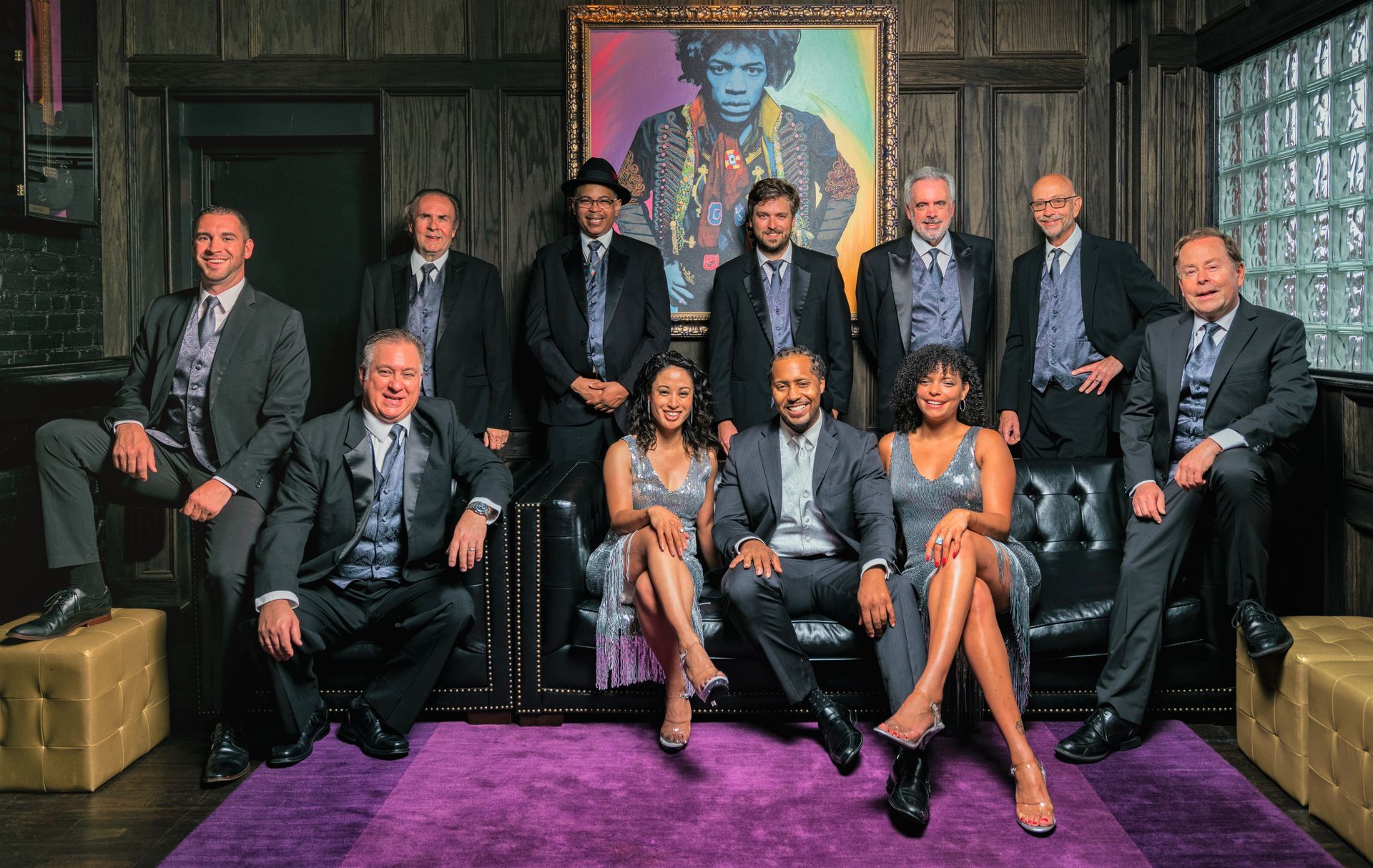 Main Street Soul posing in front of a painting of Jimi Hendrix, Michigan