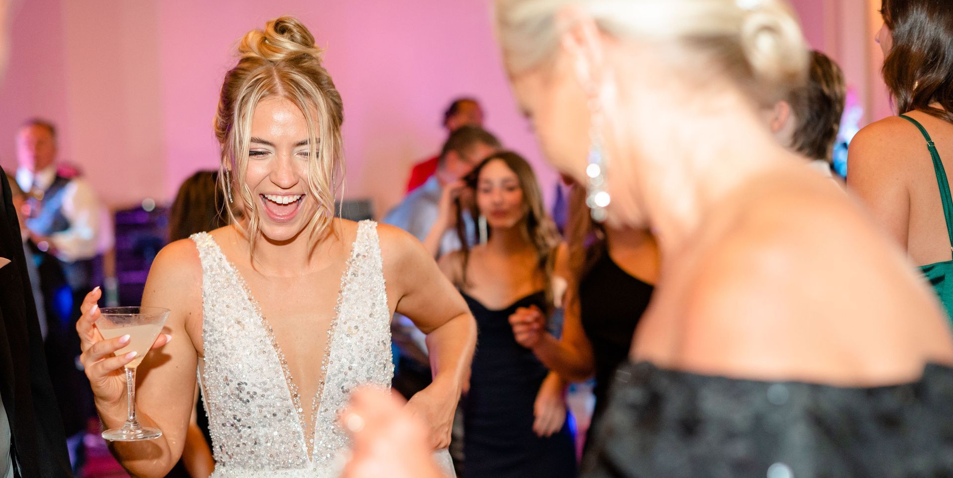 a bride and her mother are dancing at a wedding reception with Mainstreet Soul.