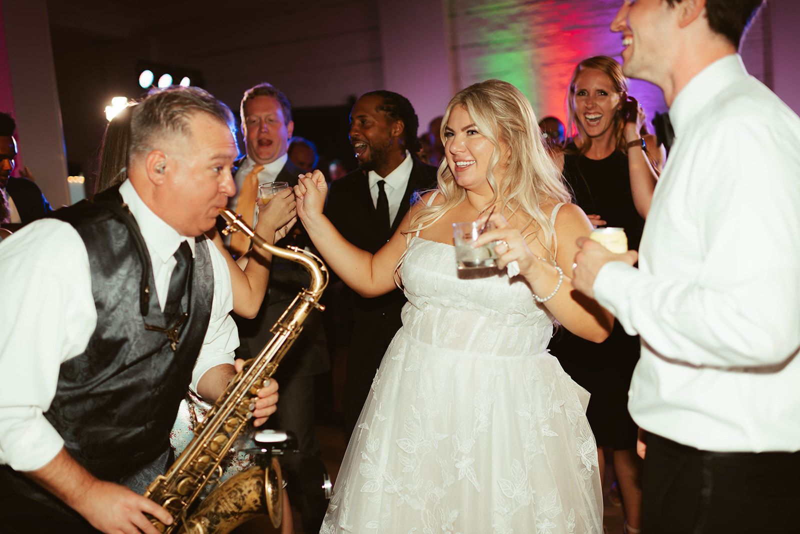 Band leader Jim, with Main Street Soul is playing a saxophone at a wedding reception in Detroit, Michigan