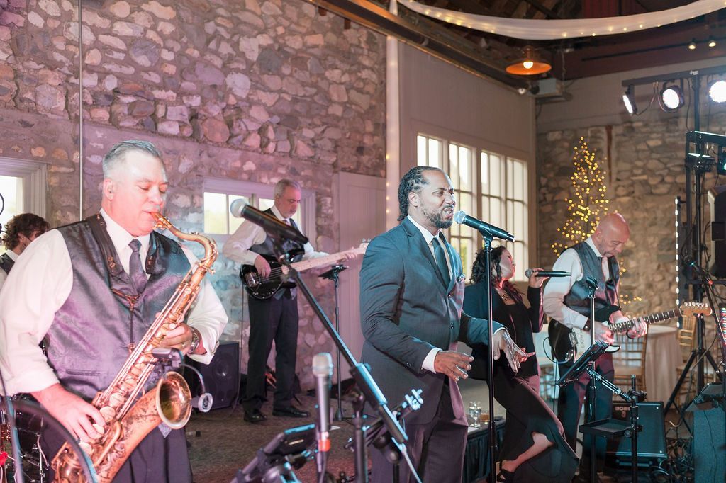 a man is playing a saxophone with Mainstreet Soul.