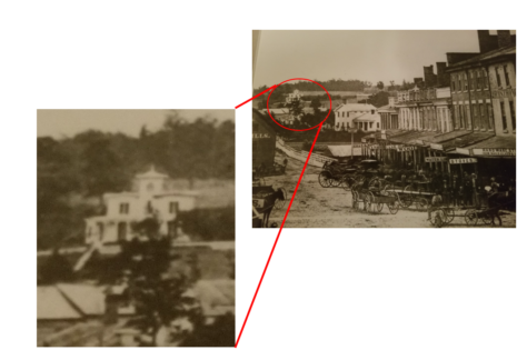 Two sepia photos linked by red lines, highlighting a building in a busy street scene.