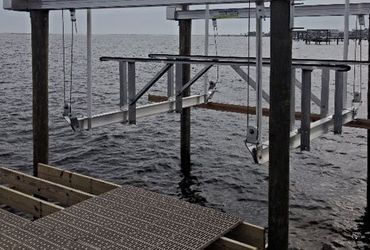 A dock in the middle of a body of water.