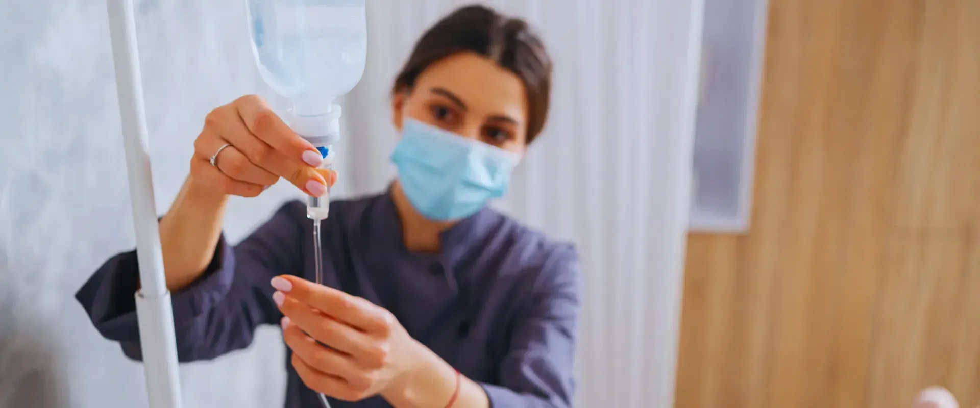 nurse adjusting the iv drip