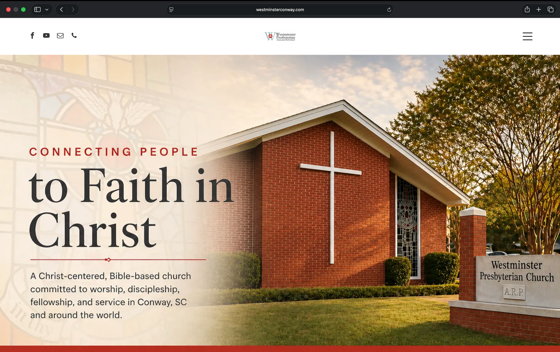 Church building with cross and banner reading “Connecting People to Faith in Christ”