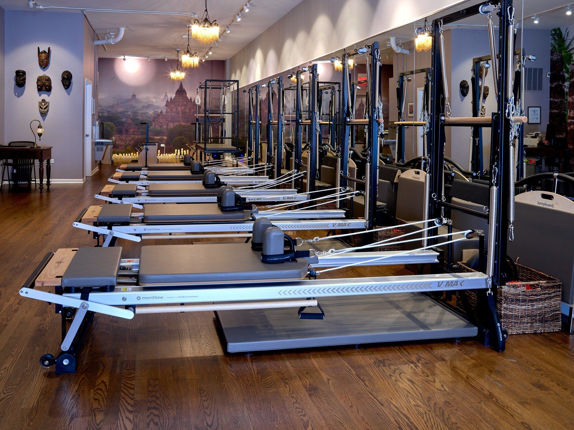 row of pilates reformers in the Metaphysical Pilates studio