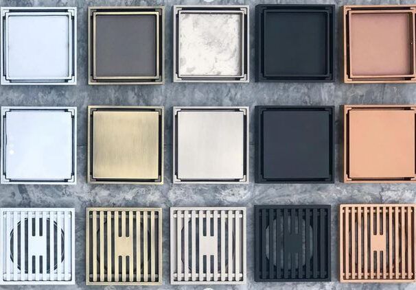 Assorted square cosmetic pans in rows of white, gray, beige, dark blue, and peach shades
