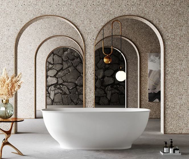 Modern bathroom with oval white tub, arched stone alcoves, and hanging pendant lights.