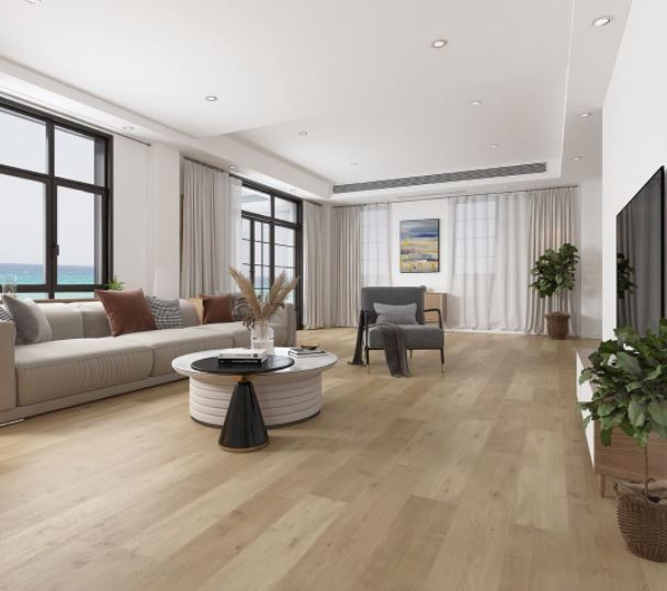 Bright modern living room with beige sofa, round coffee table, large windows, and wood flooring.