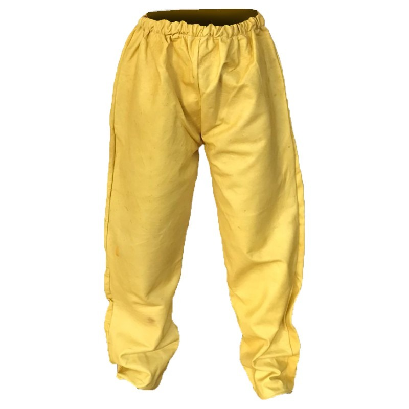 Un guante de soldar de cuero amarillo sobre un fondo liso.