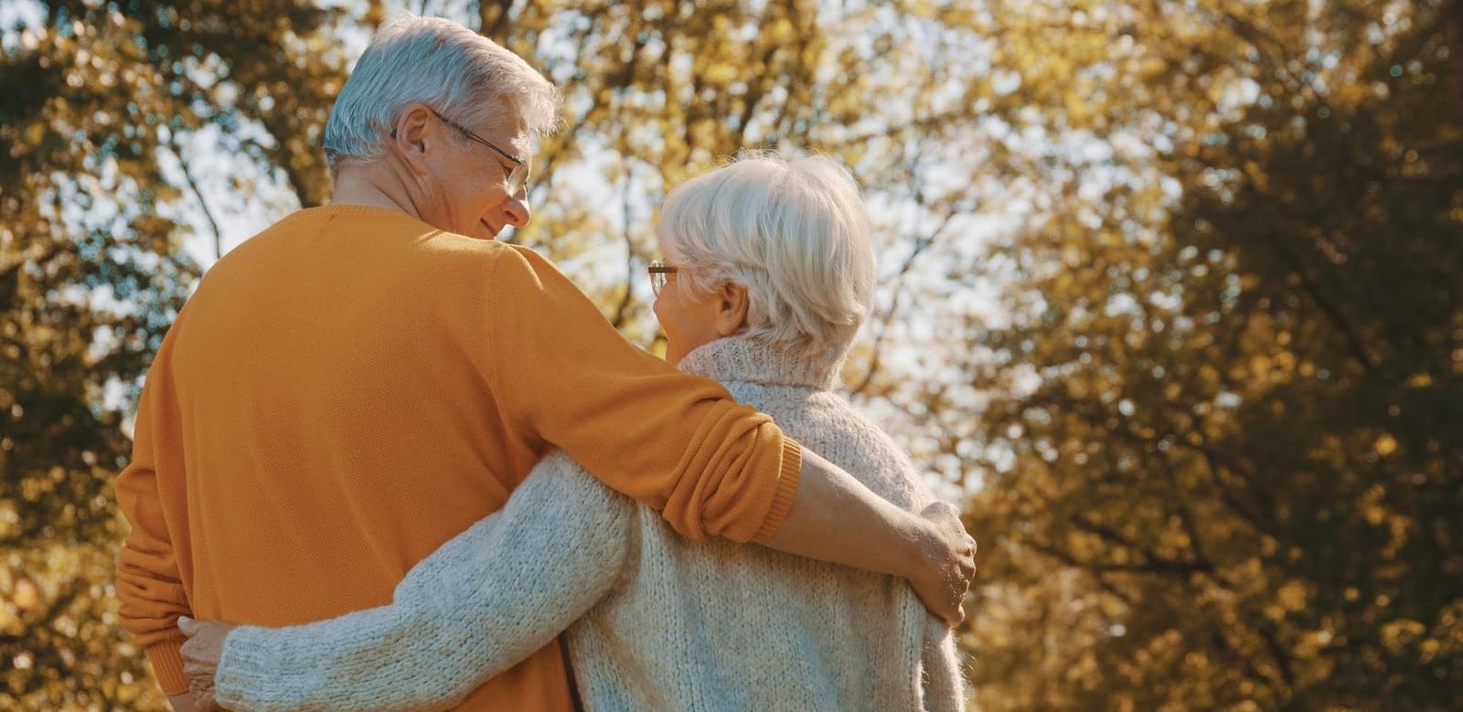 older couple with their arm around each other