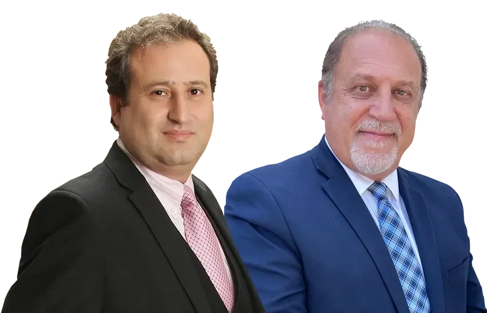 Two men in suits and ties are standing next to each other on a white background.